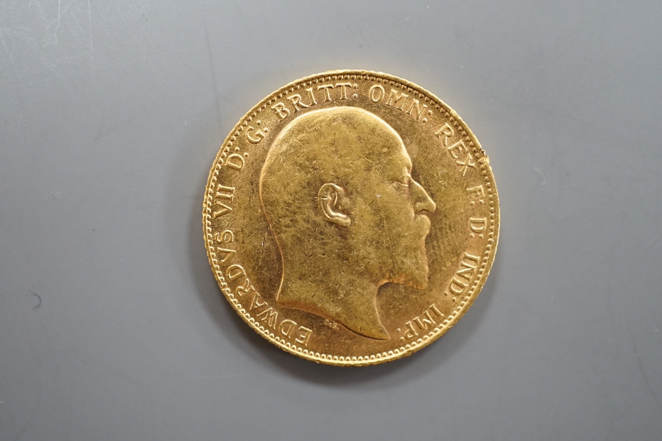 An Edward VII 1907 gold sovereign.